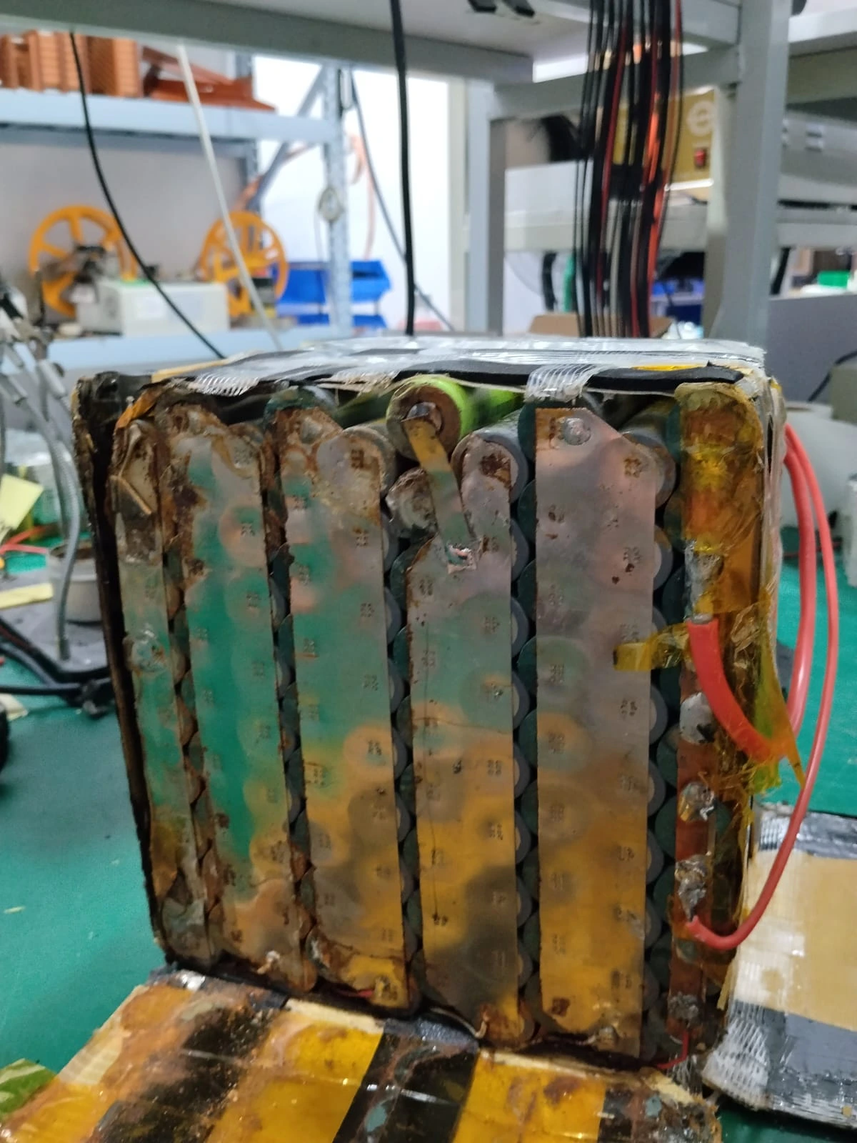 Green and brown deposits across the metal strips of an old pack.