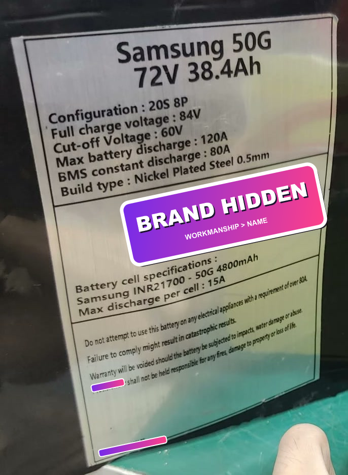 Battery specification label with a purple-pink BRAND HIDDEN sticker over the seller identity