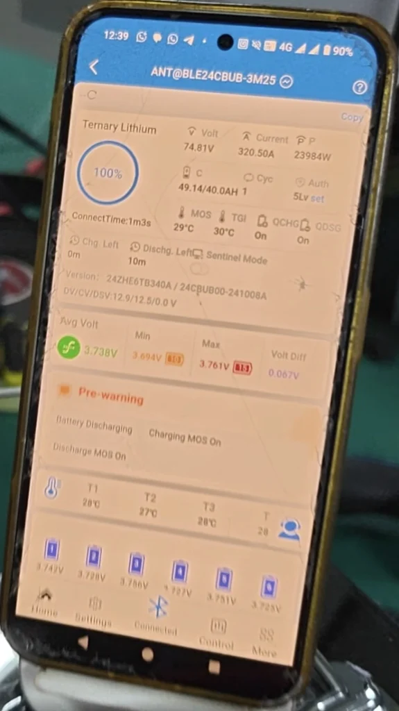 Phone showing the ANT BMS app during a load test on a 72V 40Ah EVE 40P Cube pack: 320.5 A, 23,984 W, cells within 0.067 V.