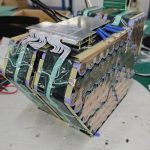 White balance leads run from the board to metal tabs along the sides of this DogeTune build.