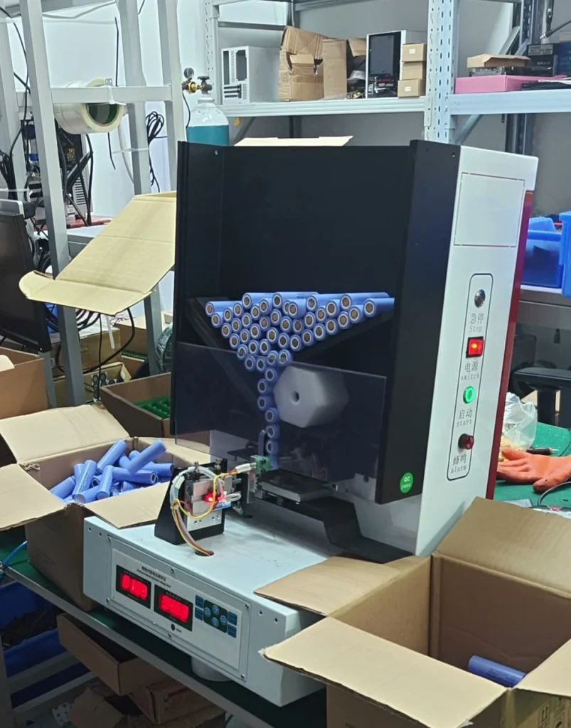 Automatic cell sorting machine with blue cells in its chute and sorting bins below
