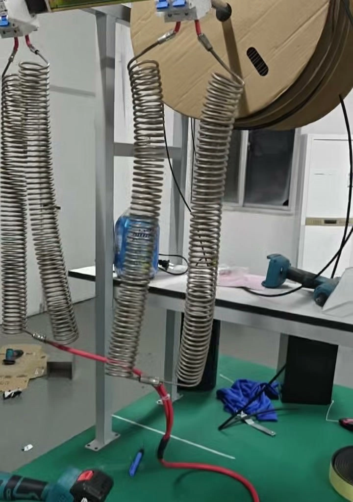 Coiled resistor load bank with a breaker and red test lead