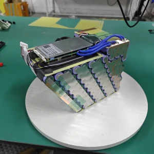 Open Razor battery assembly with visible cell connections, a circuit board and blue wiring.
