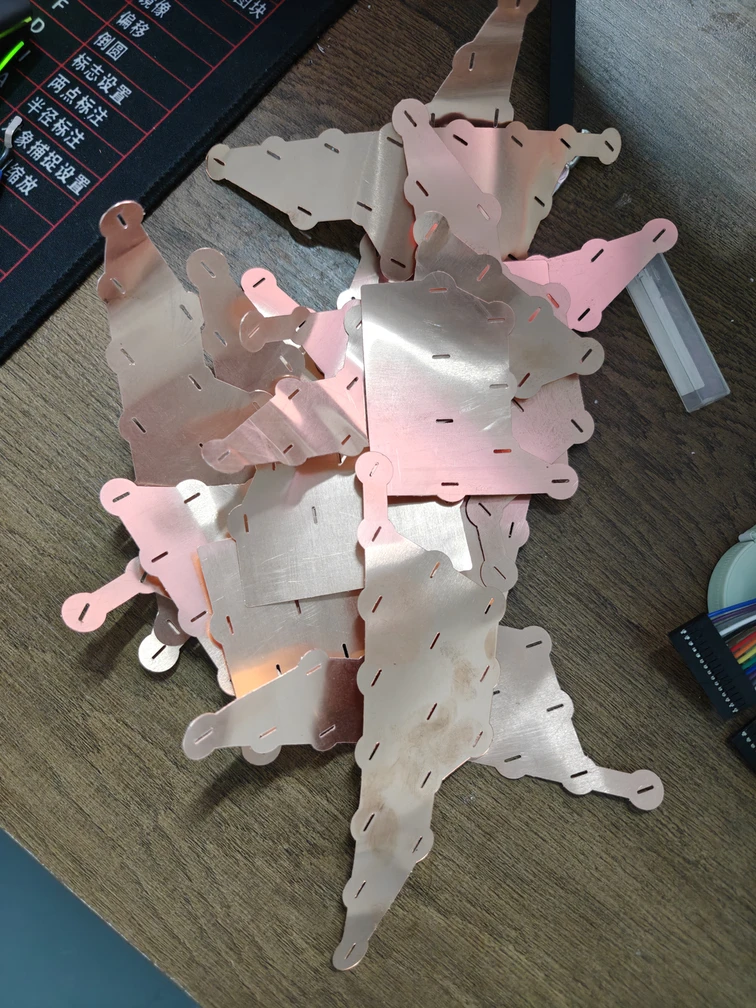Loose shaped connection plates with slotted edges and bent terminal extensions.