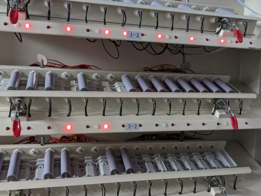 Cells arranged in a grading fixture with indicator lights