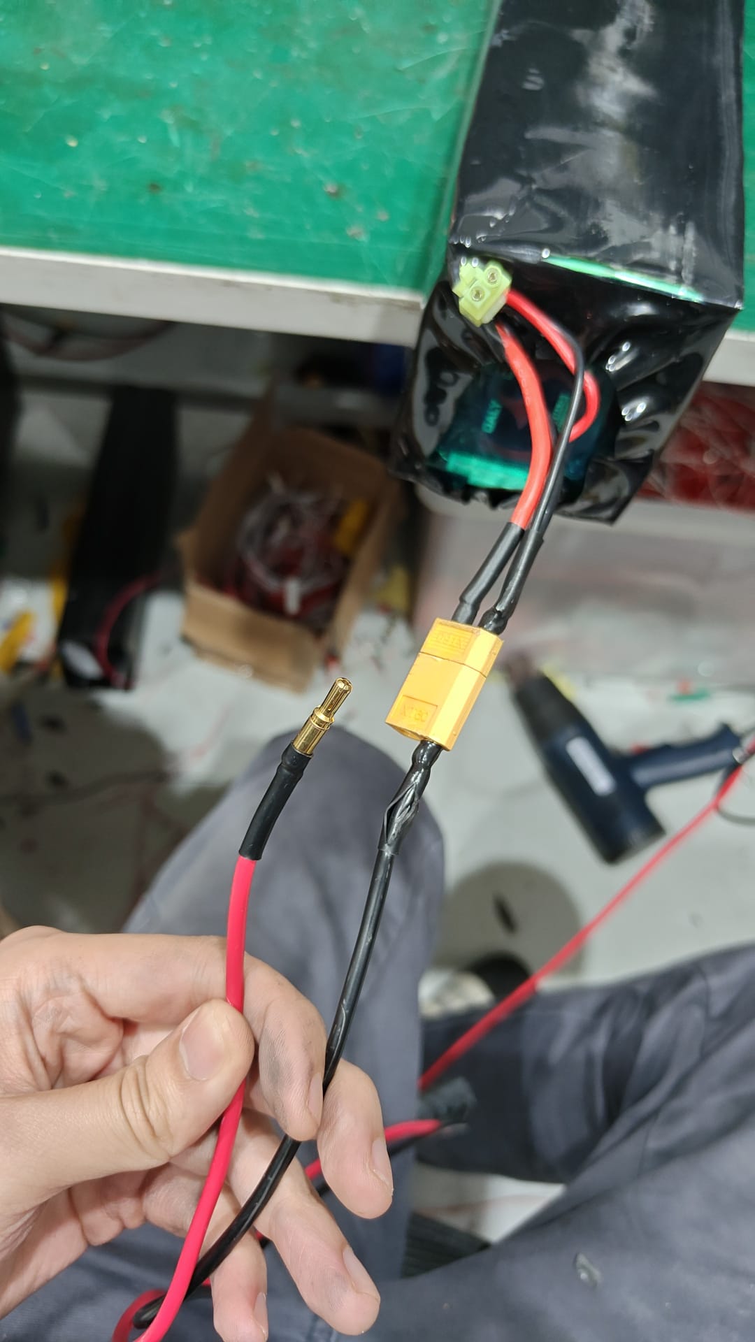 Improvised lithium battery wiring using mixed connectors and taped joints