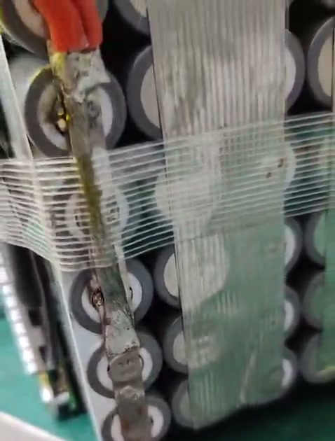 A discoloured strip across exposed cell ends, with reinforced tape over the neighbouring strips.