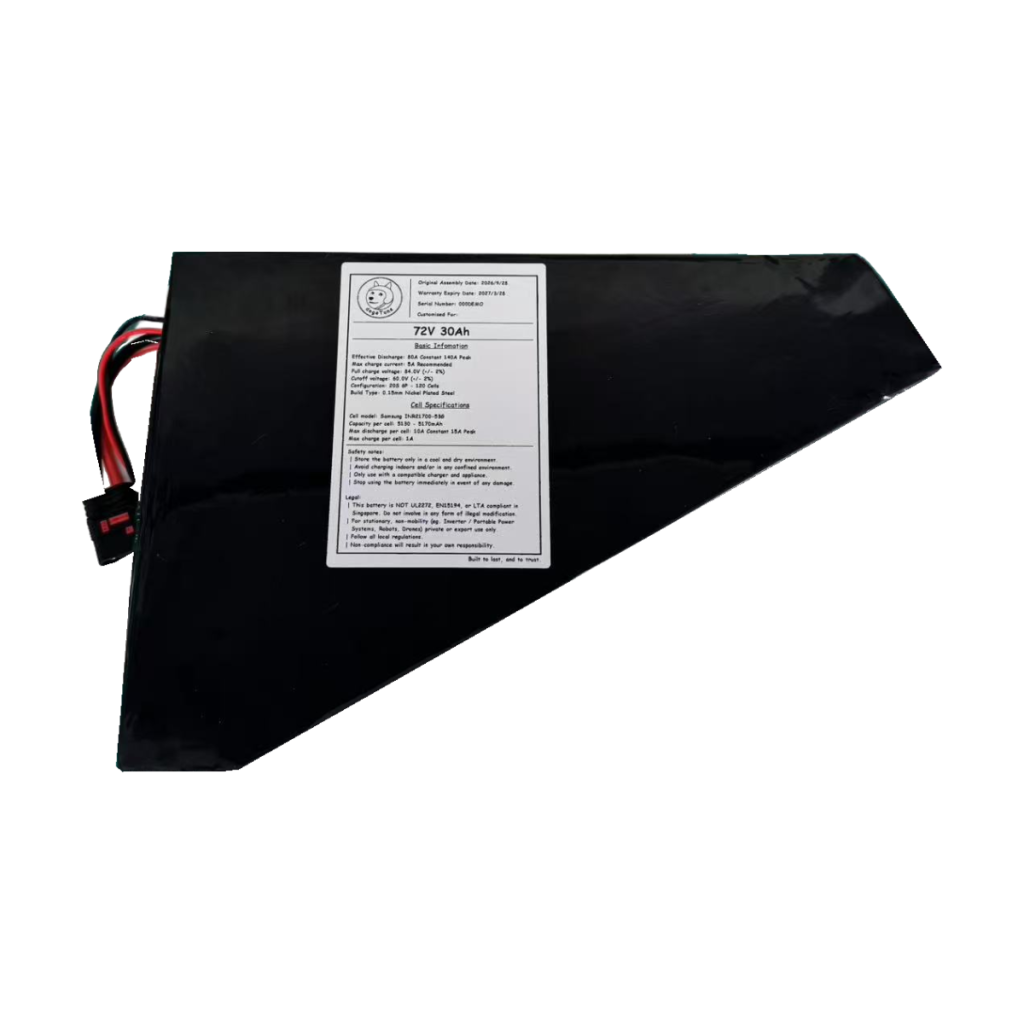 Black-wrapped triangular conversion battery with original label and leads on a transparent background