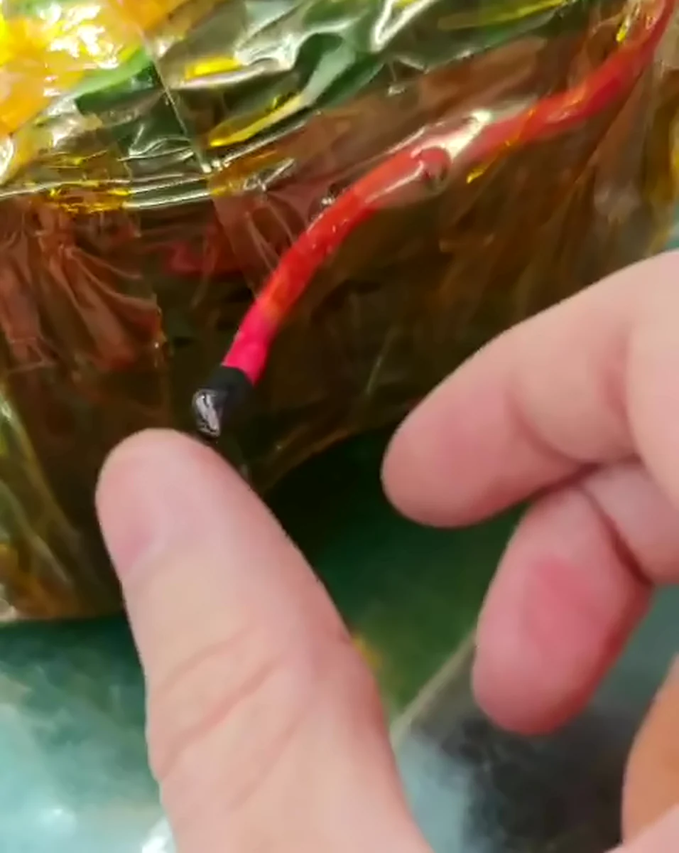 A red lead with a capped black end hanging off the end of the pack